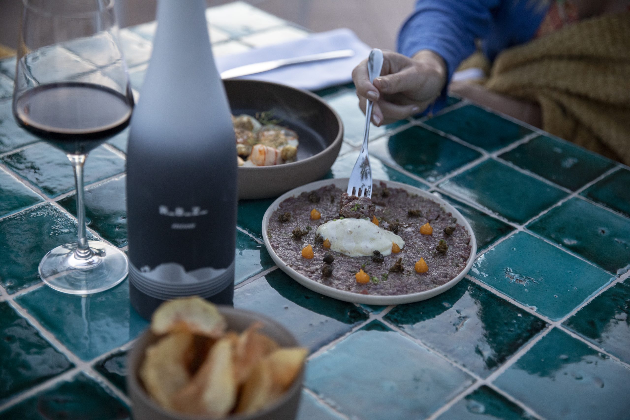 Robiza Moon red wine paired with autumn and winter seasonal dishes in a cozy setting
